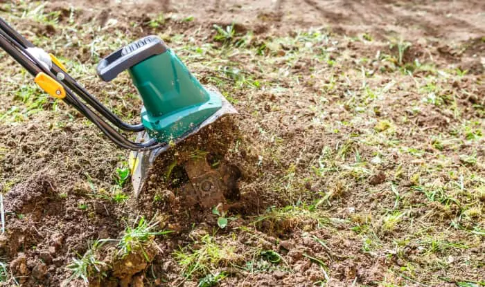 Electric tiller digging soil